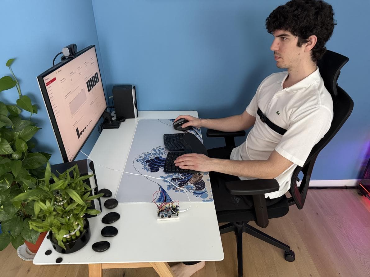 Thesis validation workstation with webcam, dashboard, and Arduino sensor on the desk